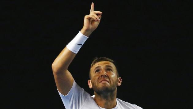 Dan Evans celebrates winning his Men's singles third round match against Australia's Bernard Tomic. (REUTERS)