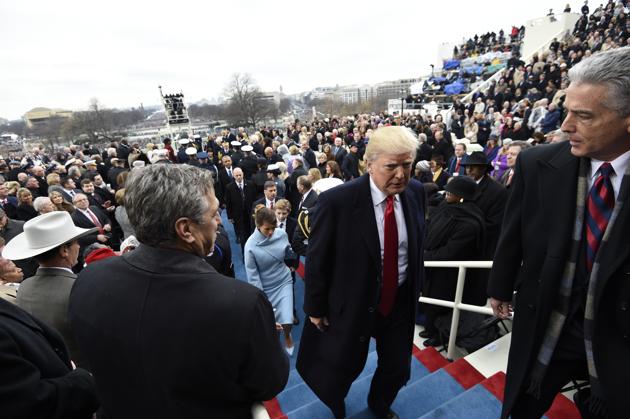 President Donald Trump leaves after taking the presidential oath, Friday, Jan. 20, 2017, on Capitol Hill in Washington. (Saul Loeb/Pool Photo via AP) (AP) President Donald Trump leaves after taking the presidential oath, Friday, Jan. 20, 2017, on Capitol Hill in Washington. (Saul Loeb/Pool Photo via AP) (AP)