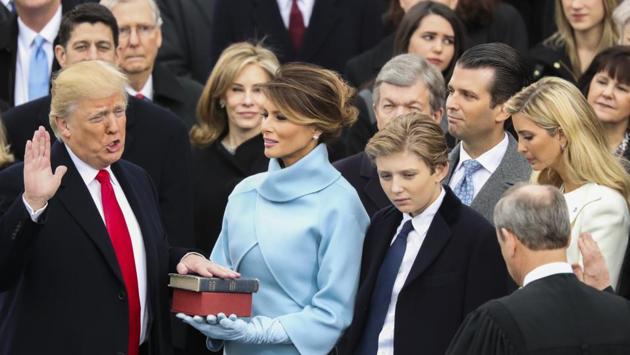 Donald Trump is sworn in as the 45th president of the United States by Chief Justice John Roberts as Melania Trump looks on during the 58th Presidential Inauguration at the US Capitol in Washington.(AP)