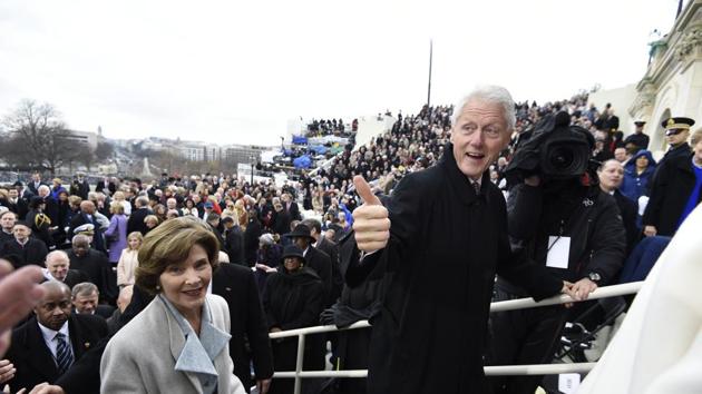 Former President Bill Clinton and former first lady Laura Bush leave after Donald Trump's presidential inauguration. (AP) Former President Bill Clinton and former first lady Laura Bush leave after Donald Trump's presidential inauguration. (AP)