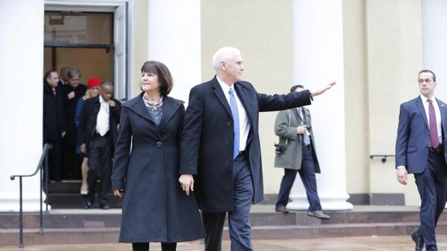 Vice-president-elect Mike Pence and his wife Karen leave a church service at St. John’s Episcopal Church across from the White House in Washington, on Friday. (AP) Vice-president-elect Mike Pence and his wife Karen leave a church service at St. John’s Episcopal Church across from the White House in Washington, on Friday. (AP)