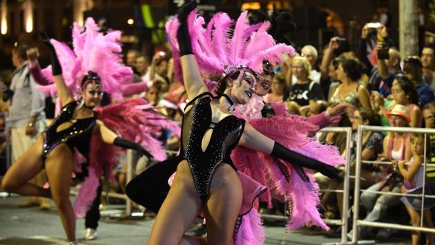 Performers participate in the opening parade of the Uruguayan carnival -- the world’s longest -- in Montevideo. The biggest carnival celebrations are in the capital Montevideo and can last up to 40 days and it involves a series of cultural events such as dance parades in the streets, street stages called “tablados” and an artistic contest in the “Teatro de Verano” (Summer Theatre) in Montevideo. (MIGUEL ROJO / AFP) Performers participate in the opening parade of the Uruguayan carnival -- the world’s longest -- in Montevideo. The biggest carnival celebrations are in the capital Montevideo and can last up to 40 days and it involves a series of cultural events such as dance parades in the streets, street stages called “tablados” and an artistic contest in the “Teatro de Verano” (Summer Theatre) in Montevideo. (MIGUEL ROJO / AFP)