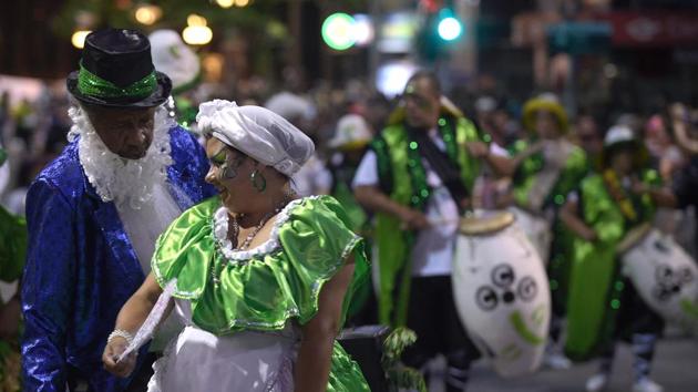 Performers participate in the opening parade of the Uruguayan carnival --the world longest-- in Montevideo, on January 19, 2017.The fiesta, also known as ‘The Parade of the Calls’, started during the colonial period as a slave parade on the city streets. (Pictured) Dancers put up a show at the parade. (MIGUEL ROJO / AFP) Performers participate in the opening parade of the Uruguayan carnival --the world longest-- in Montevideo, on January 19, 2017.The fiesta, also known as ‘The Parade of the Calls’, started during the colonial period as a slave parade on the city streets. (Pictured) Dancers put up a show at the parade. (MIGUEL ROJO / AFP)