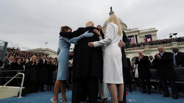 US President Donald Trump embraces his family after taking the oath of office. (REUTERS) US President Donald Trump embraces his family after taking the oath of office. (REUTERS)