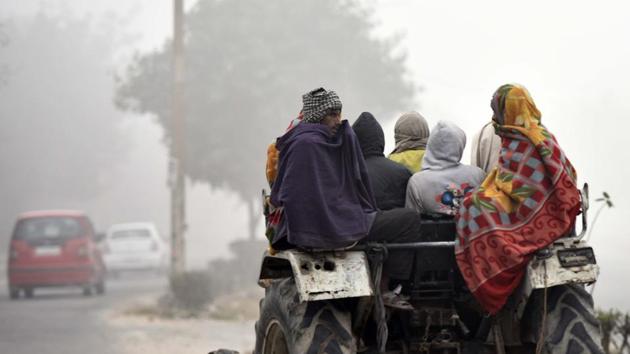 Villages clad in blankets brave the cold waves at a village on the outskirts of Delhi, near Dwarka in New Delhi. (Vipin Kumar/HT Photo) Villages clad in blankets brave the cold waves at a village on the outskirts of Delhi, near Dwarka in New Delhi. (Vipin Kumar/HT Photo)
