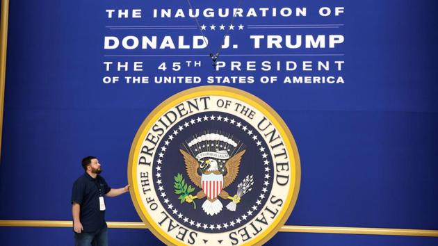 Workers install the presidential seal at the site of the Commander in Chief inaugural ball for President-elect Donald Trump in Washington, DC. (Reuters Photo) Workers install the presidential seal at the site of the Commander in Chief inaugural ball for President-elect Donald Trump in Washington, DC. (Reuters Photo)