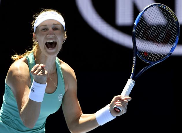 Russia's Ekaterina Makarova celebrates after defeating Slovakia's Dominika Cibulkova 6-2, 6-7 (3/7), 6-3. (AP)