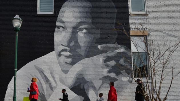 People gather to march in the annual parade down MLK Boulevard to honor Martin Luther King, in Chattanooga, Tennessee, US. (Billy Weeks/REUTERS) People gather to march in the annual parade down MLK Boulevard to honor Martin Luther King, in Chattanooga, Tennessee, US. (Billy Weeks/REUTERS)