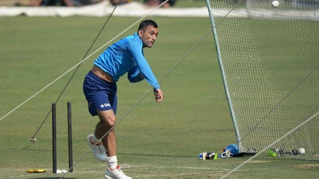 India's Mahindra Singh Dhoni bowls at the nets during an optional training session at Eden Gardens Cricket Stadium in Kolkata. (AFP)