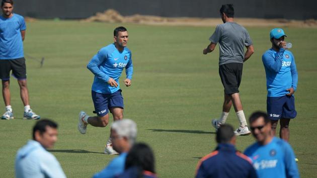 MS Dhoni (centre) bowls during an optional training session at Eden Gardens in Kolkata ahead of third India vs England ODI. (AFP) MS Dhoni (centre) bowls during an optional training session at Eden Gardens in Kolkata ahead of third India vs England ODI. (AFP)