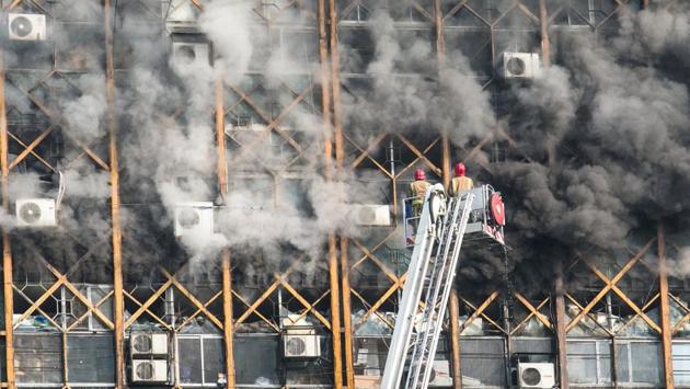 Firefighters try to put out fire at the oldest high-rise building in Tehran, Iran. (REUTERS) Firefighters try to put out fire at the oldest high-rise building in Tehran, Iran. (REUTERS)