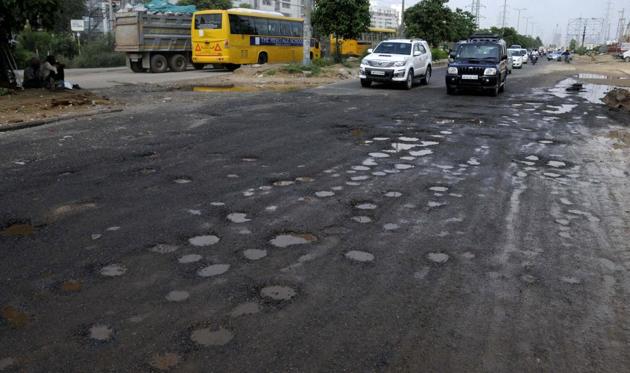Bad roads have been the bane for commuters and motorists in Gurgaon. (HT PHOTO) Bad roads have been the bane for commuters and motorists in Gurgaon. (HT PHOTO)