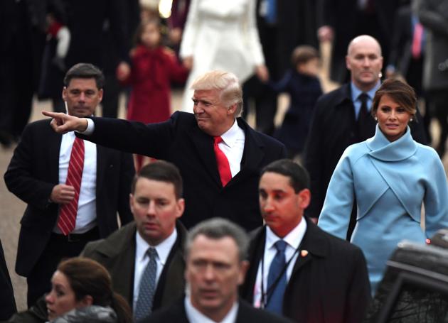 US President Donald Trump and First Lady Melania walk the inaugural parade route on Pennsylvania Avenue in Washington, DC. (AFP) US President Donald Trump and First Lady Melania walk the inaugural parade route on Pennsylvania Avenue in Washington, DC. (AFP)