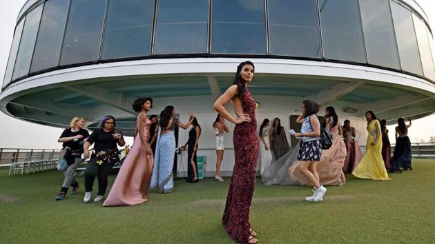 A model waits backstage during the opening show of the fashion week on board the luxury cruise. (PTI) A model waits backstage during the opening show of the fashion week on board the luxury cruise. (PTI)