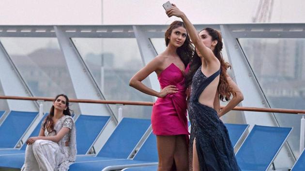 A model clicks selfie backstage during the opening show of the fashion extravaganza. (PTI) A model clicks selfie backstage during the opening show of the fashion extravaganza. (PTI)