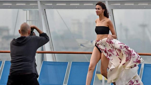 A model poses for a photo backstage during the opening show . (PTI) A model poses for a photo backstage during the opening show . (PTI)