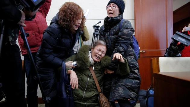 Wang Yulian, whose daughter was among passengers on-board Malaysia Airlines flight MH370, which went missing in 2014, is comforted by others as relatives arrive for a meeting with the airline representatives in Beijing, China. (Damir Sagolj/REUTERS) Wang Yulian, whose daughter was among passengers on-board Malaysia Airlines flight MH370, which went missing in 2014, is comforted by others as relatives arrive for a meeting with the airline representatives in Beijing, China. (Damir Sagolj/REUTERS)