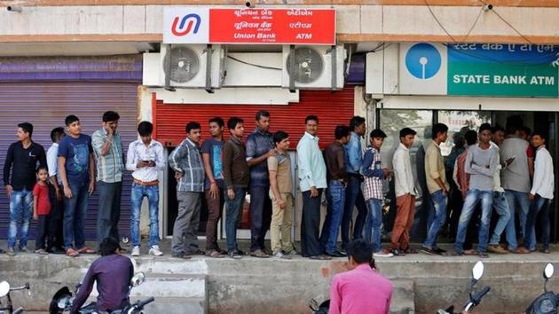 Long queues of people were a common sight at ATMs and banks within the first month of demonetisation. (Reuters File) Long queues of people were a common sight at ATMs and banks within the first month of demonetisation. (Reuters File)