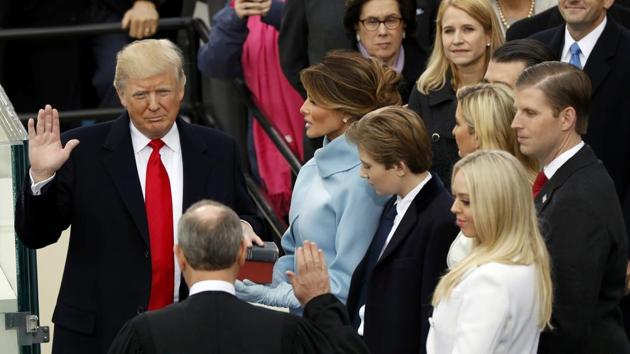 US President Donald Trump takes the oath of office with his wife Melania, and children Barron, Donald Jr., Eric, Ivanka and Tiffany at his side, during his inauguration at the US Capitol in Washington, on January 20, 2017. (Reuters) US President Donald Trump takes the oath of office with his wife Melania, and children Barron, Donald Jr., Eric, Ivanka and Tiffany at his side, during his inauguration at the US Capitol in Washington, on January 20, 2017. (Reuters)