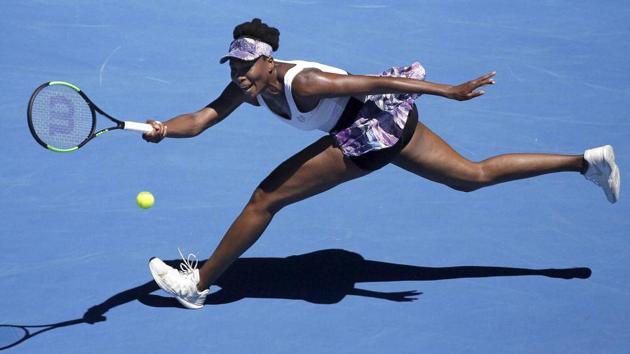 Venus Williams plays a forehand on the run to Mona Barthel during their fourth round match. She won 6-3, 7-5. (AP)
