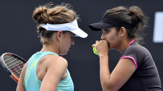 Sania Mirza (right) and partner Barbora Strycova lost their third round match to the unseeded Japanese pair of Eri Hozumi and Miyu Kato 3-6, 6-2, 2-6 on Sunday. (AP)