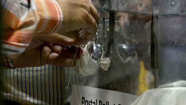 An Indian election commission officer opens a postal ballot box at a counting centre in New Delhi (AFP File Photo) An Indian election commission officer opens a postal ballot box at a counting centre in New Delhi (AFP File Photo)