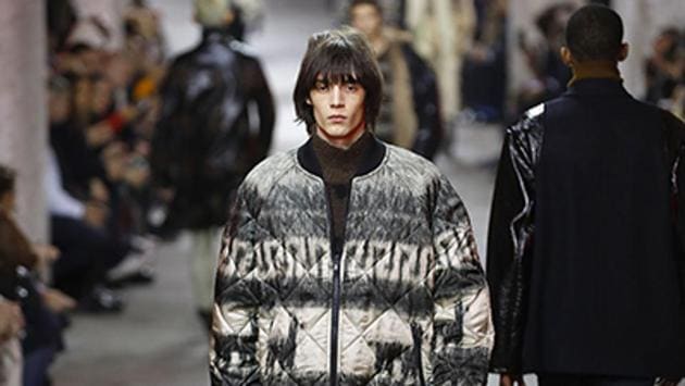 A model presents a creation by Dries Van Noten during men's Fashion Week for the Fall/Winter 2017/2018 collection in Paris. The designer teamed skinny trouser silhouettes with exaggeratedly puffed-out jackets and slouchy jumpers. (AFP) A model presents a creation by Dries Van Noten during men's Fashion Week for the Fall/Winter 2017/2018 collection in Paris. The designer teamed skinny trouser silhouettes with exaggeratedly puffed-out jackets and slouchy jumpers. (AFP)