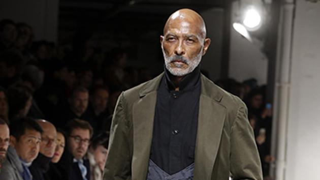 A model presents a creation by Yohji Yamamoto. The house offered a quirky take on three-piece suits, featuring waistcoats with scooped out necklines and shirts that buttoned up to the jawline. (AFP) A model presents a creation by Yohji Yamamoto. The house offered a quirky take on three-piece suits, featuring waistcoats with scooped out necklines and shirts that buttoned up to the jawline. (AFP)