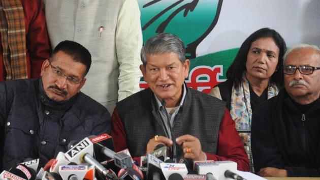CM Harish Rawat (C) and state Congress president Kishore Upadhyay (L) are among the senior leaders to get party ticket. (Vinay Santosh Kumar /HT File Photo) CM Harish Rawat (C) and state Congress president Kishore Upadhyay (L) are among the senior leaders to get party ticket. (Vinay Santosh Kumar /HT File Photo)
