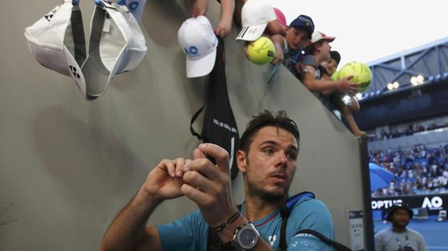 Tsonga will meet Stan Wawrinka in the quarter-final. Here, Wawrinka is seen signing autographs after beating Italy's Andreas Seppi 7-6 (7/2), 7-6 (7/4), 7-6 (7/4). (REUTERS)