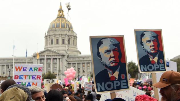 Thousands of people gather at City Hall to protest President Donald Trump and to show support for women's rights in San Francisco on January 21, 2017. Hundreds of thousands of protesters spearheaded by women's rights groups demonstrated across the US to send a defiant message to US President Donald Trump. (AFP) Thousands of people gather at City Hall to protest President Donald Trump and to show support for women's rights in San Francisco on January 21, 2017. Hundreds of thousands of protesters spearheaded by women's rights groups demonstrated across the US to send a defiant message to US President Donald Trump. (AFP)