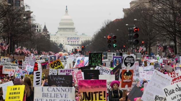 Anti-Trump demonstrators walk down Pennsylvania Avenue during the Women's March on Washington on Saturday. (AFP) Anti-Trump demonstrators walk down Pennsylvania Avenue during the Women's March on Washington on Saturday. (AFP)