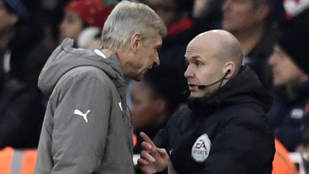 Arsenal manager Arsene Wenger clashes with fourth official Anthony Taylor before being sent to the stands during his team’s Premier League match against Burnley. (REUTERS) Arsenal manager Arsene Wenger clashes with fourth official Anthony Taylor before being sent to the stands during his team’s Premier League match against Burnley. (REUTERS)