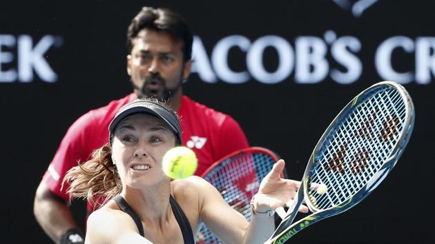 Switzerland's Martina Hingis hits a backhand as partner India's Leander Paes watches during their mixed doubles match against Nikola Mektic and Brian Baker. (AP) Switzerland's Martina Hingis hits a backhand as partner India's Leander Paes watches during their mixed doubles match against Nikola Mektic and Brian Baker. (AP)