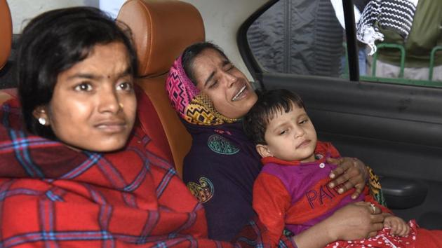 Daughter of Nazrul Islam, Lajma, in her mother’s lap.(Sushil Kumar/HT Photo)