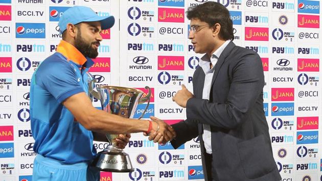 Sourav Ganguly presents the  trophy to India cricket team captain Virat Kohli. (BCCI) 