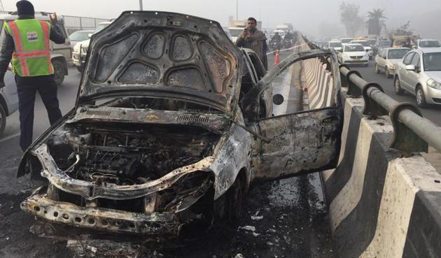 A Tata Indica car caught fire around 8.30 am at IFFCO Chowk. As per NHAI officials, the driver escaped unhurt.(Parveen Kumar/HT Photo) A Tata Indica car caught fire around 8.30 am at IFFCO Chowk. As per NHAI officials, the driver escaped unhurt.(Parveen Kumar/HT Photo)