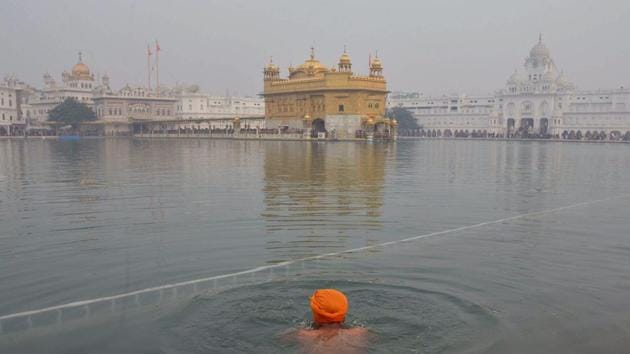 A Delhi resident was arrested on Monday for tearing pages of the holy book inside the Golden Temple in Amritsar. (AFP File Photo) A Delhi resident was arrested on Monday for tearing pages of the holy book inside the Golden Temple in Amritsar. (AFP File Photo)