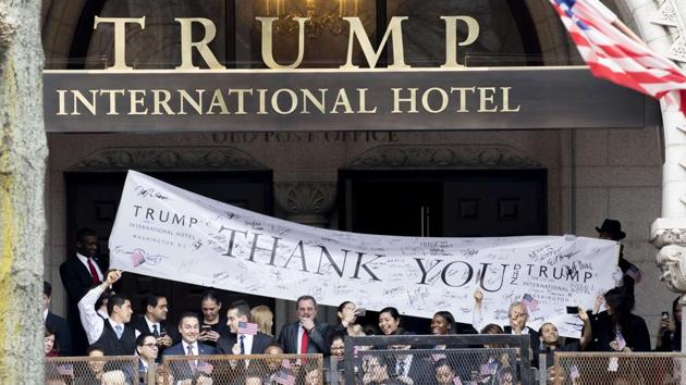 Trump International Hotel employees cheer during the inaugural parade on January 20 in Washington, DC. (AFP file photo) Trump International Hotel employees cheer during the inaugural parade on January 20 in Washington, DC. (AFP file photo)