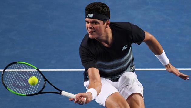 Canada's Milos Raonic hits a return against Spain's Roberto Bautista Agut. (AFP) Canada's Milos Raonic hits a return against Spain's Roberto Bautista Agut. (AFP)