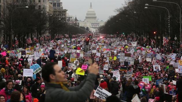 Protesters walk during the Women's March on Washington, with the U.S. Capitol in the background, in Washington, DC. Large crowds are attending the anti-Trump rally a day after U.S. President Donald Trump was sworn in as the 45th U.S. president. (Mario Tama/AFP) Protesters walk during the Women's March on Washington, with the U.S. Capitol in the background, in Washington, DC. Large crowds are attending the anti-Trump rally a day after U.S. President Donald Trump was sworn in as the 45th U.S. president. (Mario Tama/AFP)