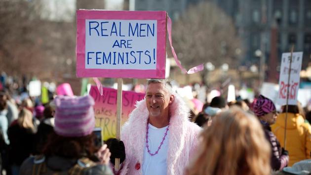 A demonstrator holds a placard in support during the Women's March at Civic Center Park in Denver, Colorado. Organizers said they drew nearly 5 million protesters in all, far surpassing crowd expectations. (Jason Connolly/AFP) A demonstrator holds a placard in support during the Women's March at Civic Center Park in Denver, Colorado. Organizers said they drew nearly 5 million protesters in all, far surpassing crowd expectations. (Jason Connolly/AFP)