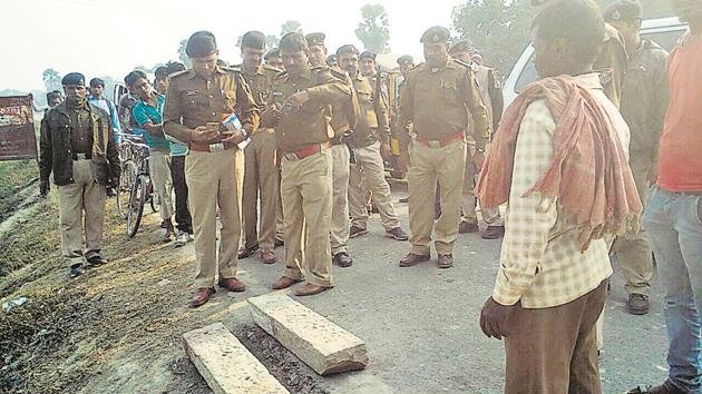 GRP personnel inspect the site after removing the two stone slabs placed on railway tracks. (HT photo) GRP personnel inspect the site after removing the two stone slabs placed on railway tracks. (HT photo)