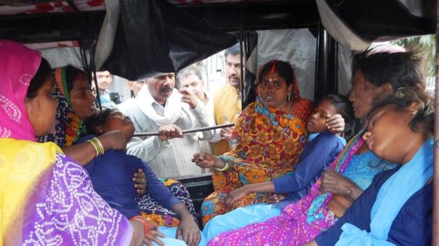 Family members taking injured girls to hospital. (HT Photo) Family members taking injured girls to hospital. (HT Photo)