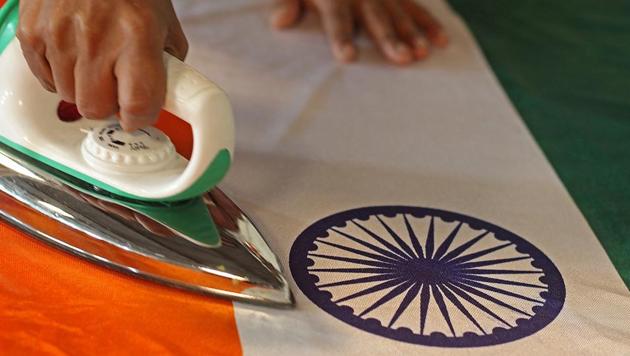 A man gets the  Tricolour, which was designed by Pingali Venkayya,  ready for Republic Day. (Satyabrata Tripathy/HT photo) 