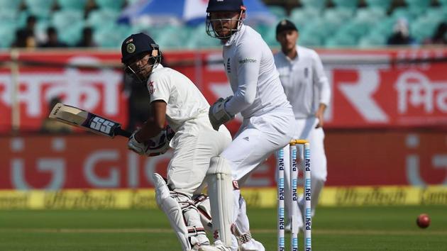 England's wicket keeper Jonny Bairstow watches as India's Wriddhiman Saha plays a shot during the second day of the second Test cricket match between India and England at the Dr. Y.S. Rajasekhara Reddy ACA-VDCA Cricket Stadium in Vishakhapatnam on November 18, 2016. (AFP) England's wicket keeper Jonny Bairstow watches as India's Wriddhiman Saha plays a shot during the second day of the second Test cricket match between India and England at the Dr. Y.S. Rajasekhara Reddy ACA-VDCA Cricket Stadium in Vishakhapatnam on November 18, 2016. (AFP)