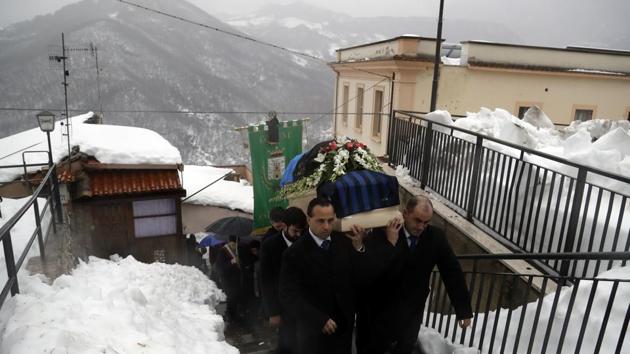 The coffin of Alessandro Giancaterino, one of the victims of the avalanche which buried the Hotel Rigopiano, is shoulder carried prior to the start of the funeral service in Farindola, central Italy,on Tuesday.(AP)