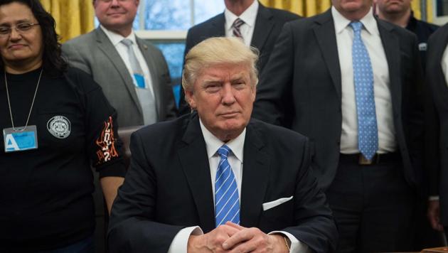 US President Donald Trump poses with labour leaders on January 23, 2017 in the Oval Office at the White House in Washington. (AFP) US President Donald Trump poses with labour leaders on January 23, 2017 in the Oval Office at the White House in Washington. (AFP)