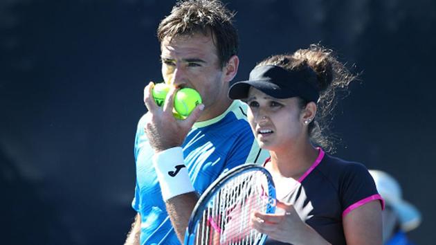 Sania Mirza and Ivan Dodig of Croatia beat Rohan Bopanna and Gabriela Dabrowski in tie-break to enter the semifinals of the mixed doubles event at the Australian Open.(Getty Images)