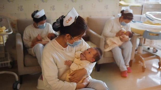China’s population is expected to peak at about 1.45 billion around 2030 . (AFP File Photo) China’s population is expected to peak at about 1.45 billion around 2030 . (AFP File Photo)